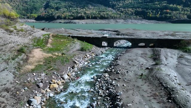 Roman bridge and sunken town of Saqu&eacute;s in the Bubal reservoir. Aerial view from a drone. Jaca Stone. Biescas Municipality. The Jacetania. Huesca, Aragon, Spain, Europe