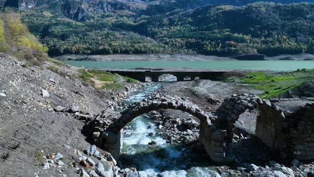 Roman bridge and sunken town of Saqu&eacute;s in the Bubal reservoir. Aerial view from a drone. Jaca Stone. Biescas Municipality. The Jacetania. Huesca, Aragon, Spain, Europe