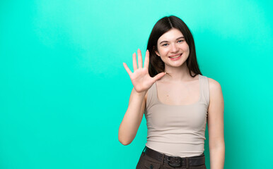 Young Russian woman isolated on green background counting five with fingers