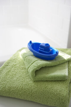 Bath Towels and Toy Boat