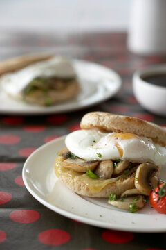 Poached Eggs with Sauteed Mushrooms and Grilled Tomato on Whole Wheat English Muffin
