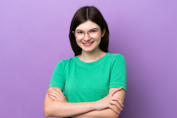 Young pretty Russian woman isolated on purple background With glasses with happy expression