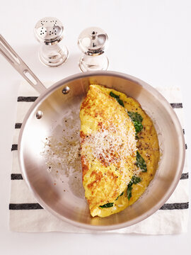 Overhead View of Omelette in Frying Pan with Salt and Pepper, Studio Shot