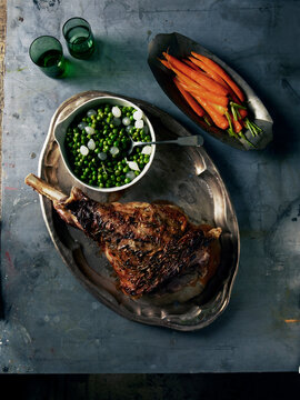 Overhead View of Roast Lamb with Carrots and Peas, Studio Shot