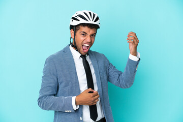 Young business Brazilian man with bike helmet isolated on blue background making guitar gesture