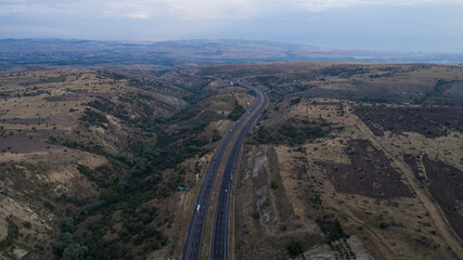 Aerial view of highway and sunset.4K UHD Aerial photo.