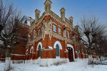 winter evening at the building of the old stud farm