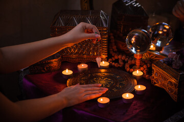 Astrology and esoteric concept. Altar with zodiac signs some stuff for horoscope, candles and...