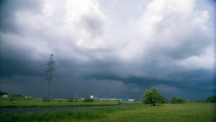 Thunderstorm approaching to power line