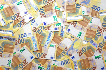 a new 200 euro banknotes background - 555983156