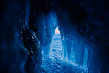 Ice grotto cave, frozen lake