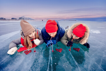 Group tourist drink cocktail winter ice kiss of Lake Baikal with cranberry heart. Concept travel...