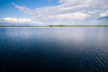 lake with clouds in summer noon