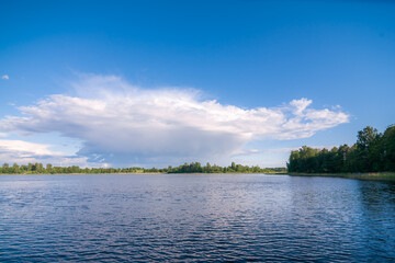 lake with clouds in summer noon