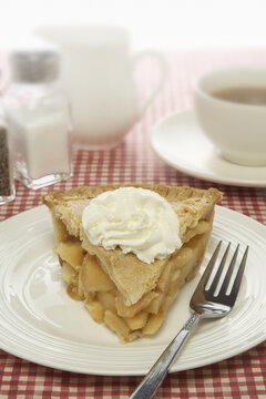 Apple Pie with Whipped Cream on Plate