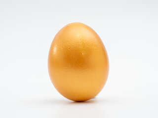 Golden eggs on a white background. Golden chicken eggs.