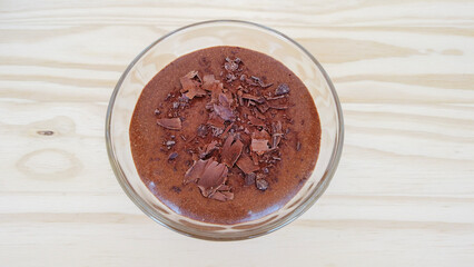 Homemade chocolate mousse on a glass. Top view