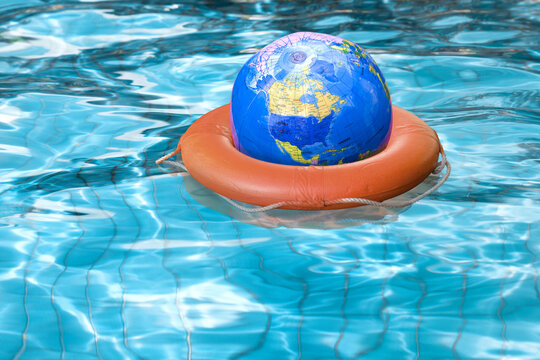 Globe in Life Preserver in Pool