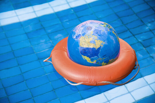 Globe in Life Preserver in Pool