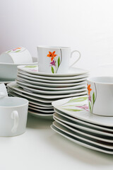 cups and plates with the image of flowers 