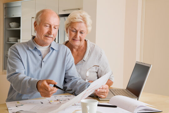 Couple Looking at Floor Plans