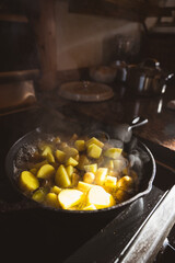 Potatoes roasting in a cast iron pan