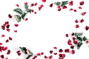 Flowers  composition of dry red roses. Frame made of dried rose flowers, petals  and leaves on...