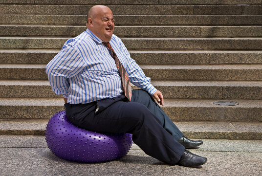 Businessman Using Exercise Ball