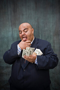 Portrait of Businessman with Cash