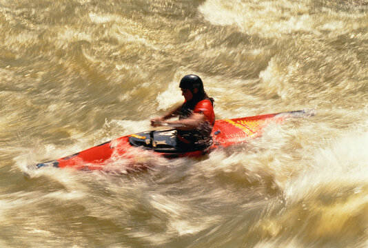 Man Kayaking on Ococee River, North Carolina, USA
