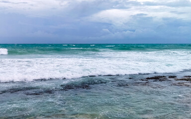 beach during hurricane and enjoys Mexico.