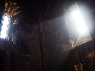 Divine light , the interior of an ancient church, unity with God. Geghard Monastery in Armenia. The Monastery of the spear,