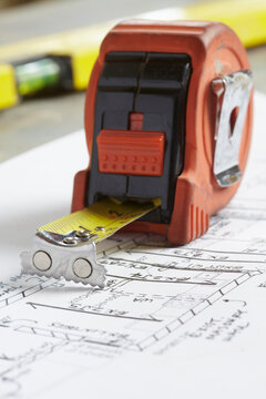 Home Renovation Still Life with Tape Measure and Blueprint