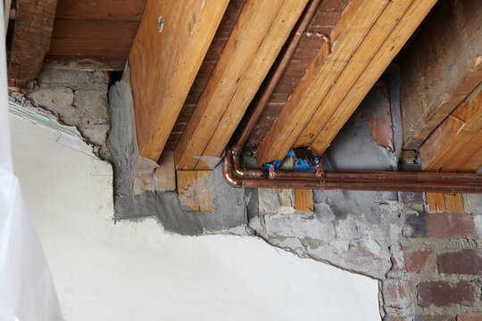 Copper Pipes and Ceiling Joists of Home Under Construction