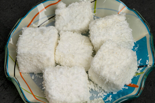 Detail of traditional brazilian sweet called Maria mole made with shredded coconut and marsmellow