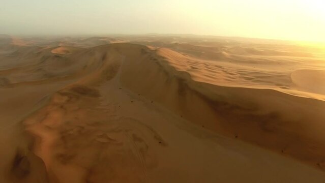 Desert landscape, nature sand and drone aerial view of natural horizon and texture sand dunes in Abu Dhabi UAE. Morning sunrise flare, freedom peace and surface environment of Arabic desert climate