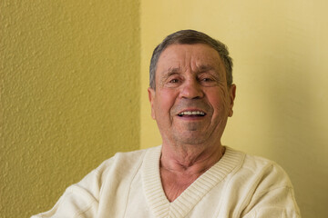Obraz premium Portrait of retired happiness senior man sitting at home