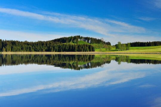 Landscape and Sky Reflecting in Lake, Sameister Weiher, Rosshaupten, Bavaria, Germany