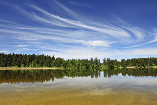 Landscape and Sky Reflected in Lake Hegratsried in Spring, Hegratsried, Halblech, Swabia, Bavaria, Germany