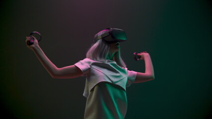 Excited woman experiencing handheld trackpads videogame closeup. Future concept