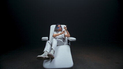 Smart teen touching invisible interface in VR glasses. Future technology concept