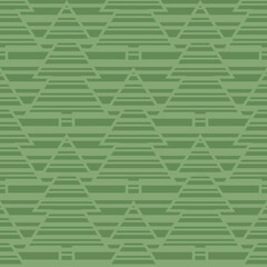 Monochrome green seamless vector pattern with striped Christmas trees on striped background. Abstract geometric design for wrapping paper, interior decoration and stationary.