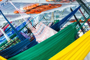 Hammocks hanged on the cruise on the Rio Amazons on the way to Belem from Manaus in Brazil