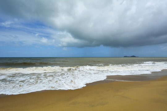 Sandy Beach with Storm Clouds in Summer, Captain Cook Highway, Queensland, Australia