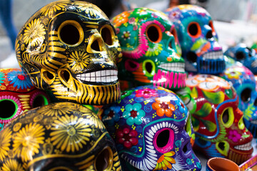 golden colorful mexican ceramic skulls, hand painted day of the dead