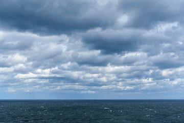 Nimbostratus clouds forming over the choppy North Sea, United Kingdom