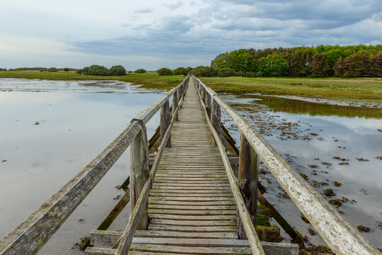 Wooden footbridge over Aberlady Bay in East Lothian in Scotland, United Kingdom