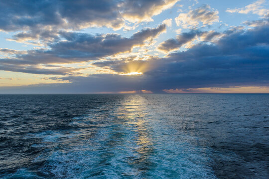 Ship's wake at sunset over the North Sea, United Kingdom