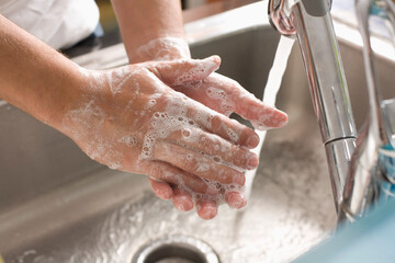 Man Washing his Hands