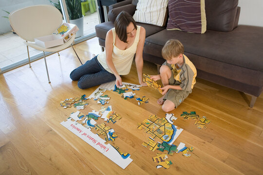 Mother and Son Doing Jigsaw Puzzle